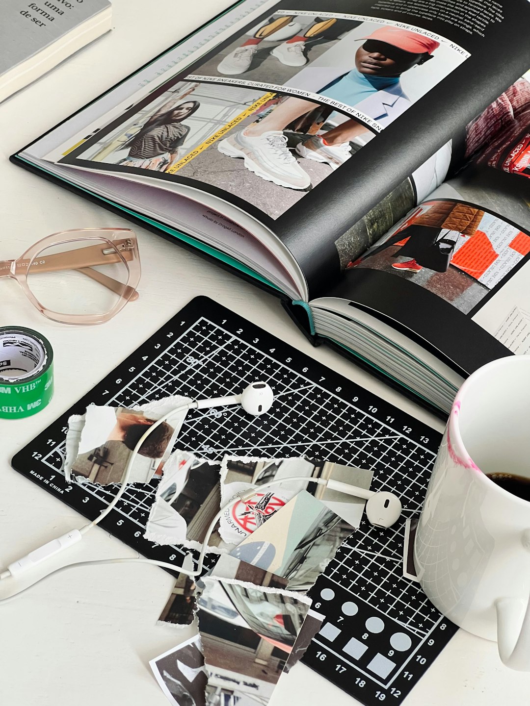 an-open-book-sitting-on-top-of-a-table-next-to-a-cup-of-coffee-ys2phgbhfju